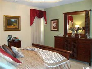 613 Colbert Way Fort Mill, SC 29715 - Photo 7 of 16 a bedroom with a bed and a dresser