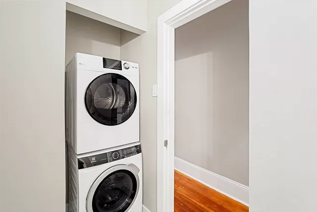 a view of a hallway with washer and dryer