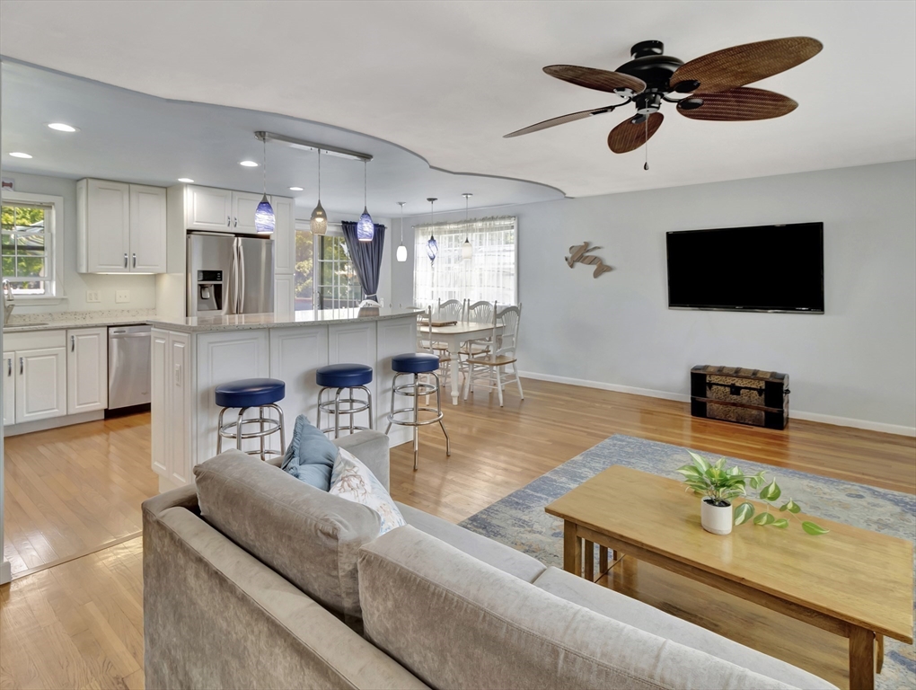 15 H Street Hull, MA 02045 - Photo 16 of 35 a living room with fireplace furniture and a flat screen tv