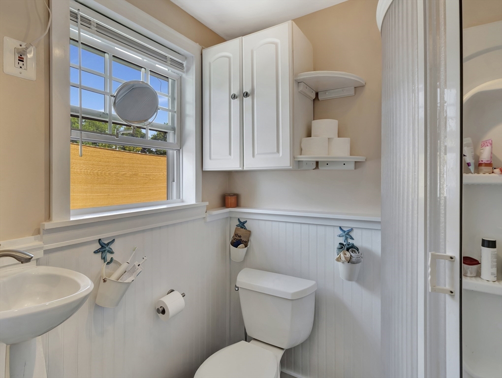15 H Street Hull, MA 02045 - Photo 23 of 35 a bathroom with a toilet sink and mirror