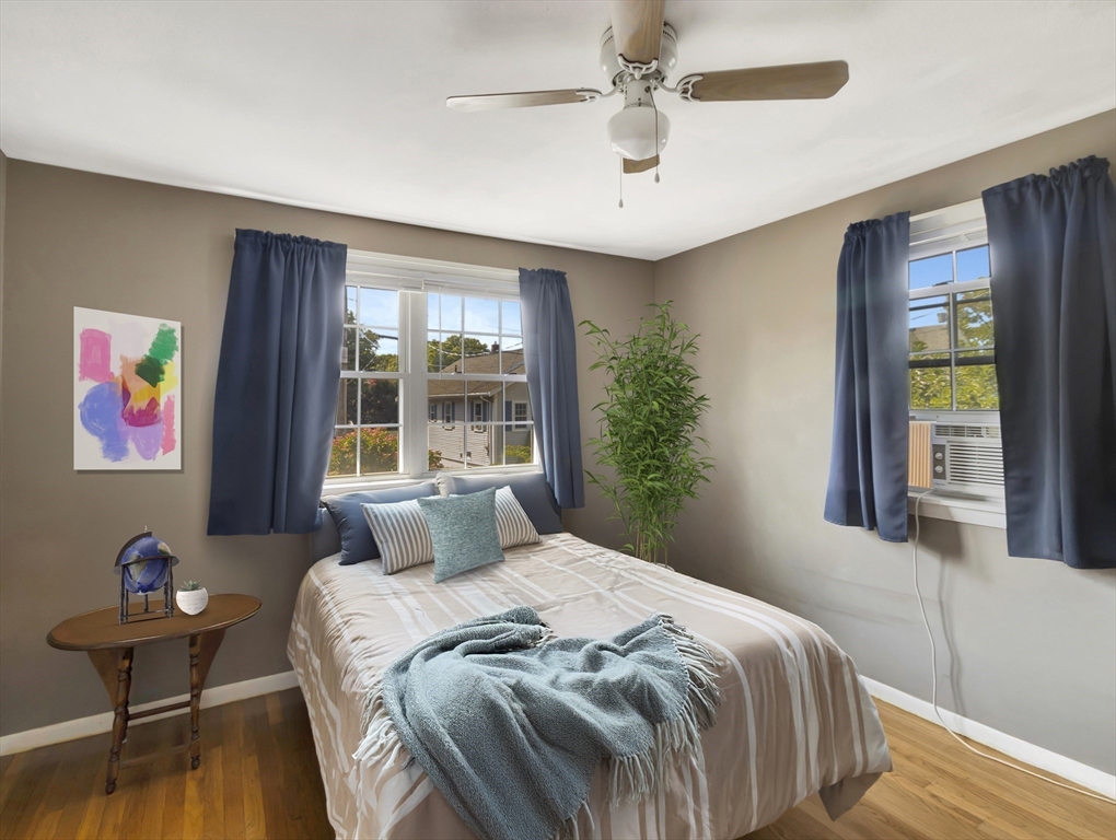 15 H Street Hull, MA 02045 - Photo 26 of 35 a bedroom with a bed and wooden floor