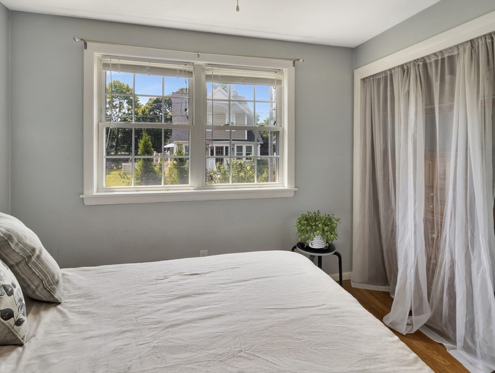 15 H Street Hull, MA 02045 - Photo 27 of 35 a bedroom with a bed and a window