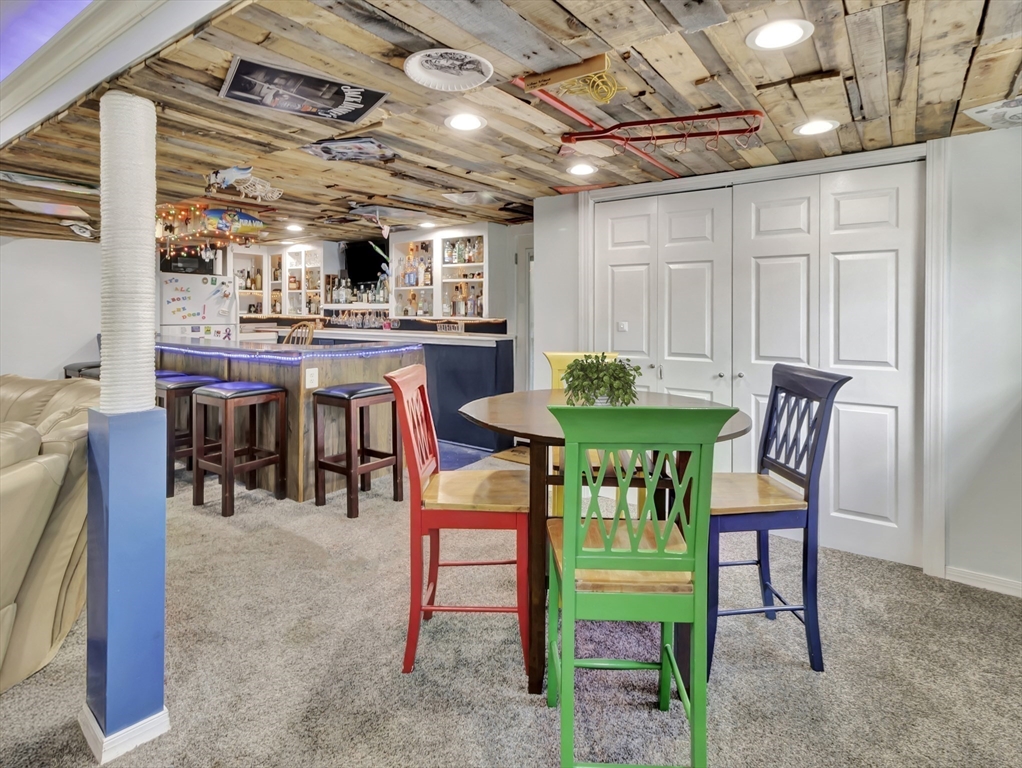 15 H Street Hull, MA 02045 - Photo 31 of 35 a dining room with furniture and a kitchen view