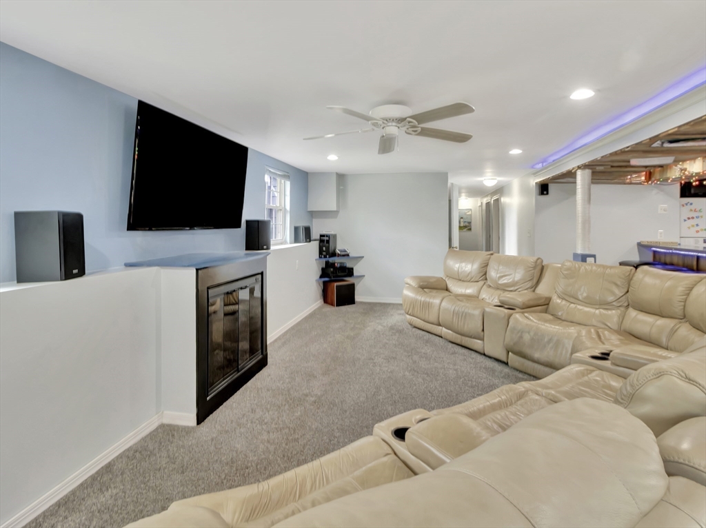 15 H Street Hull, MA 02045 - Photo 32 of 35 a living room with furniture and a flat screen tv