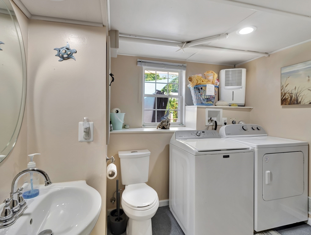 15 H Street Hull, MA 02045 - Photo 33 of 35 a bathroom with a toilet sink and mirror