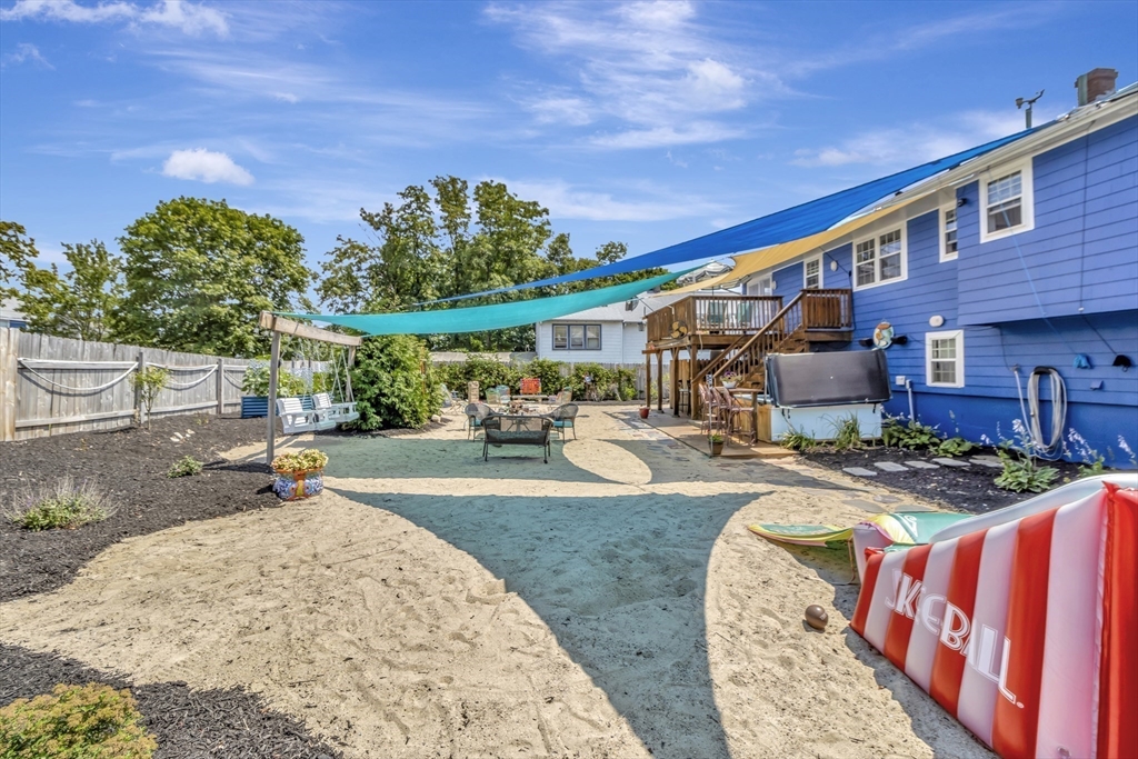 15 H Street Hull, MA 02045 - Photo 4 of 35 a view of a backyard with a patio