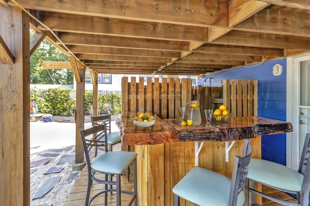 15 H Street Hull, MA 02045 - Photo 6 of 35 a room with furniture and a table