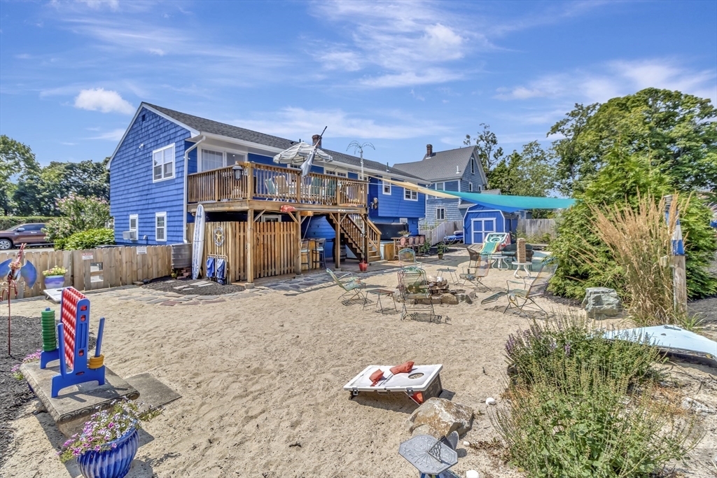 15 H Street Hull, MA 02045 - Photo 10 of 35 a view of the house with backyard and sitting area
