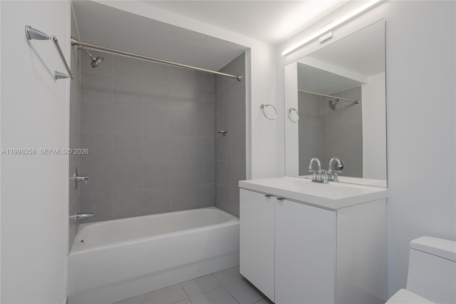 92 Southwest 3rd Street, Unit 3512 Miami, FL 33130 - Photo 17 of 67 a bathroom with a sink a toilet and shower