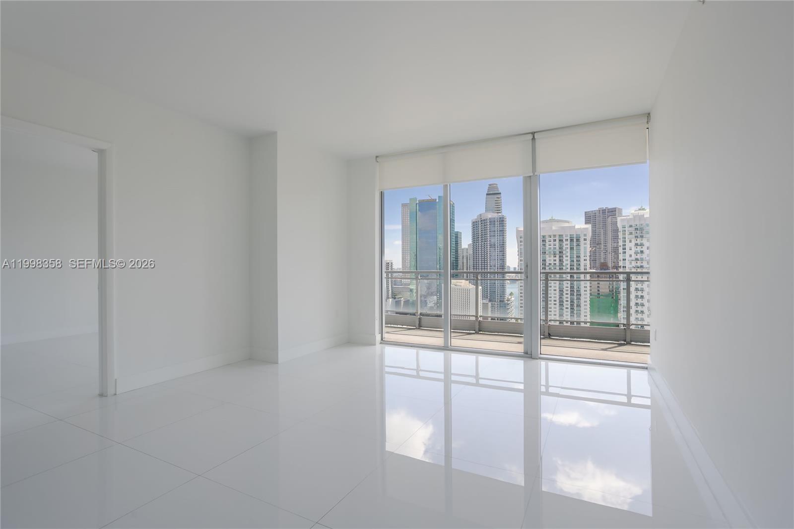 92 Southwest 3rd Street, Unit 3512 Miami, FL 33130 - Photo 2 of 67 a room with a large window and bed