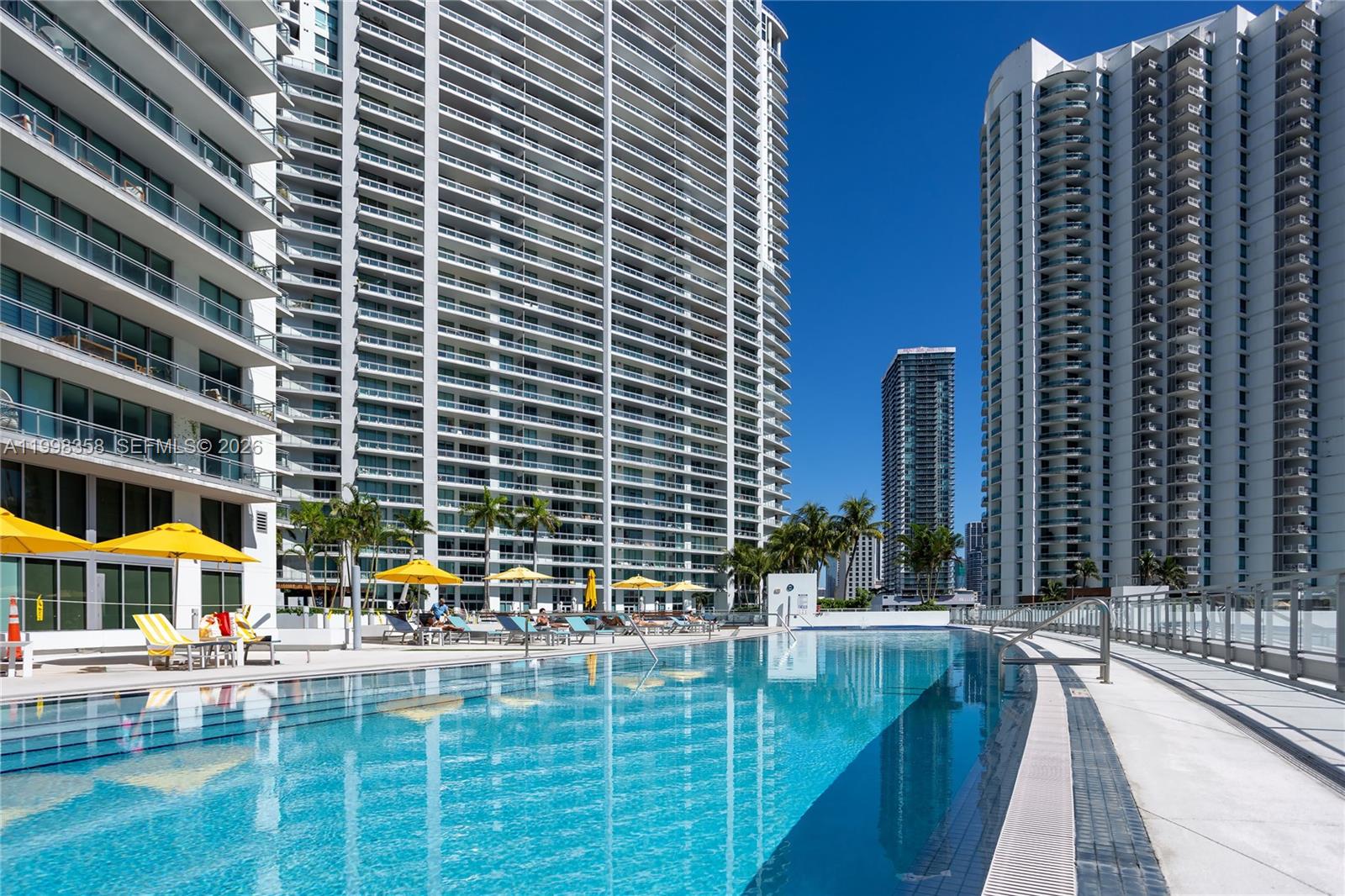 92 Southwest 3rd Street, Unit 3512 Miami, FL 33130 - Photo 32 of 67 a view of swimming pool with chairs