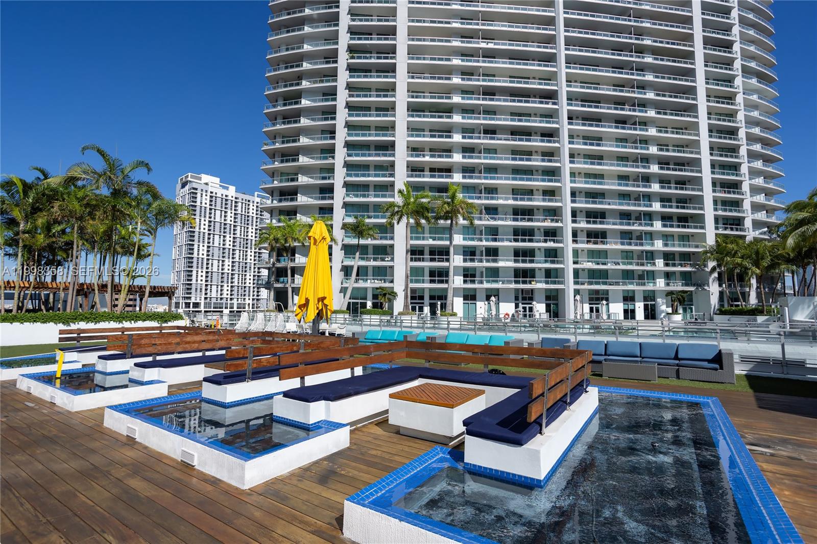 92 Southwest 3rd Street, Unit 3512 Miami, FL 33130 - Photo 34 of 67 a swimming pool with outdoor seating
