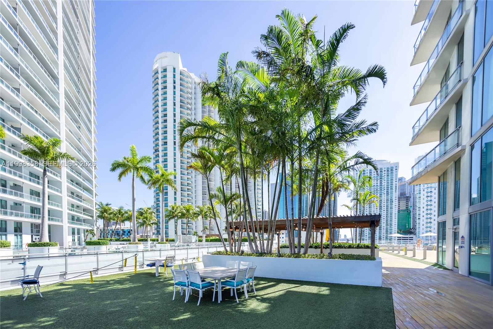 92 Southwest 3rd Street, Unit 3512 Miami, FL 33130 - Photo 39 of 67 a view of a swimming pool with chairs