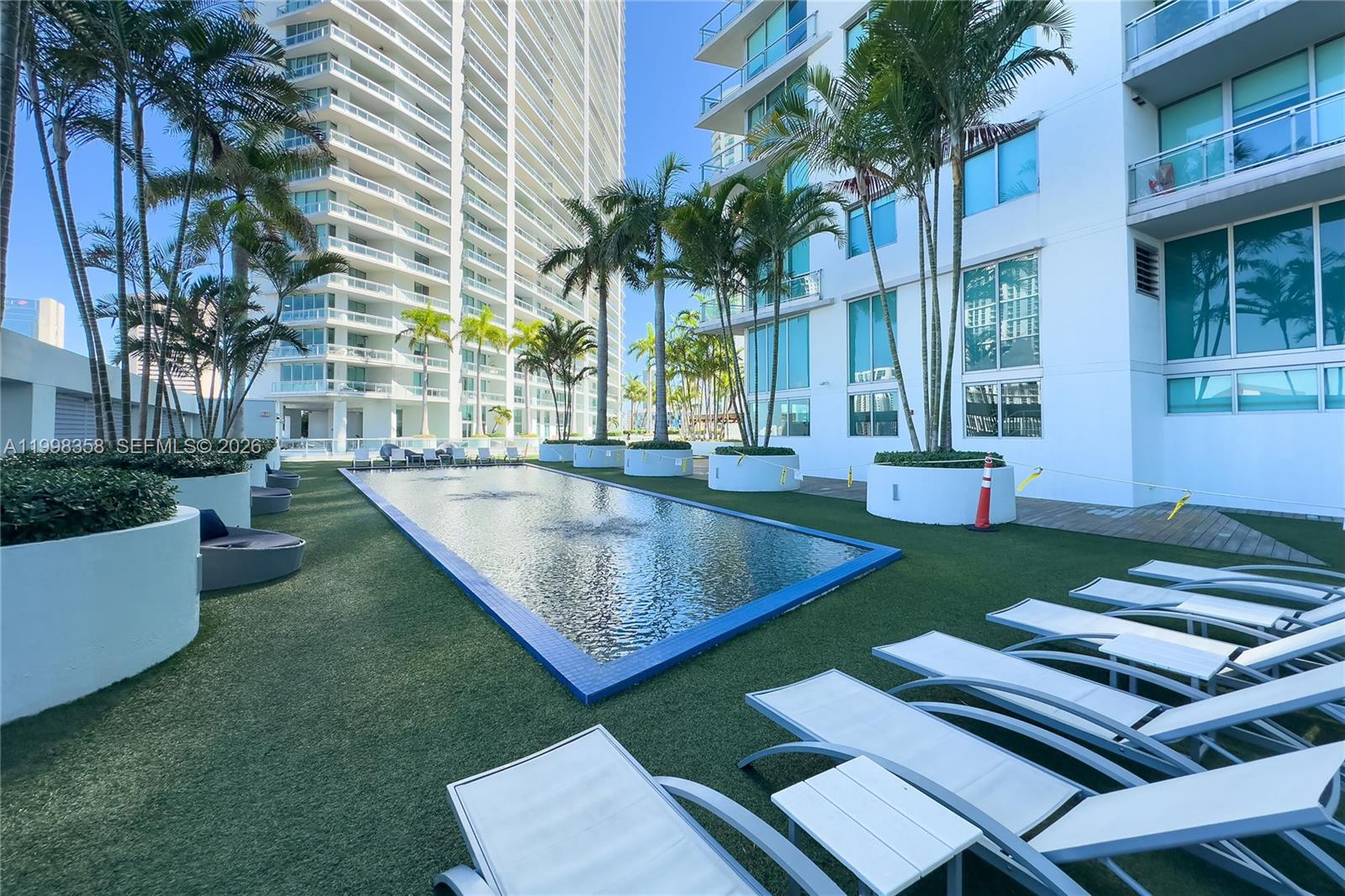92 Southwest 3rd Street, Unit 3512 Miami, FL 33130 - Photo 67 of 67 a view of a backyard with plants and outdoor seating