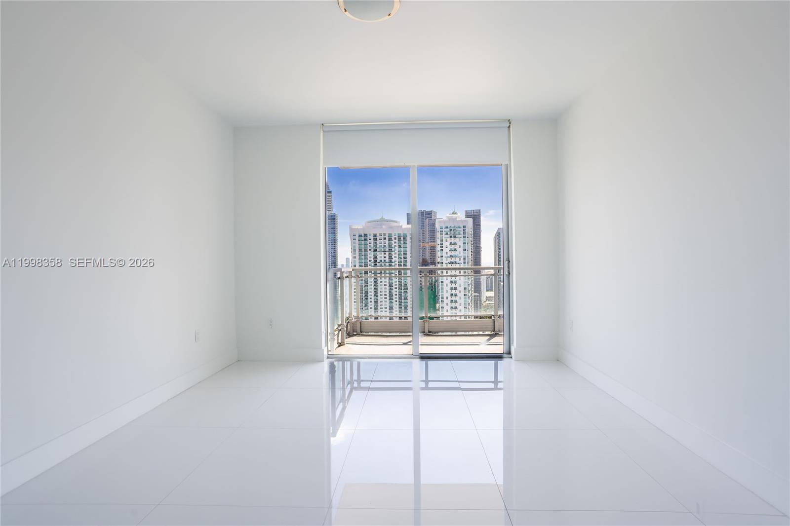 92 Southwest 3rd Street, Unit 3512 Miami, FL 33130 - Photo 8 of 67 a hallway with a large window in a kitchen