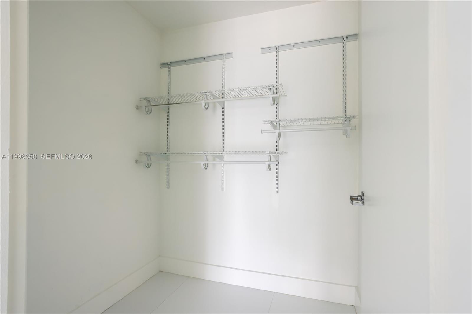 92 Southwest 3rd Street, Unit 3512 Miami, FL 33130 - Photo 10 of 67 a bathroom with a glass shower door