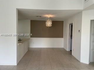 18324 Northwest 68th Avenue, Unit H Hialeah, FL 33015 - Photo 2 of 15 a view of a bathtub in a room