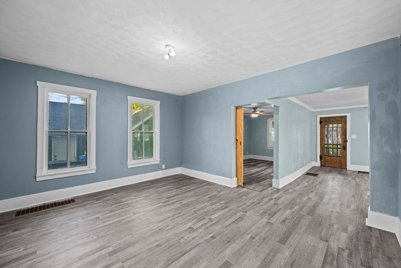 1419 17th Street Moline, IL 61265 - Photo 12 of 28 a view of an empty room with wooden floor and windows