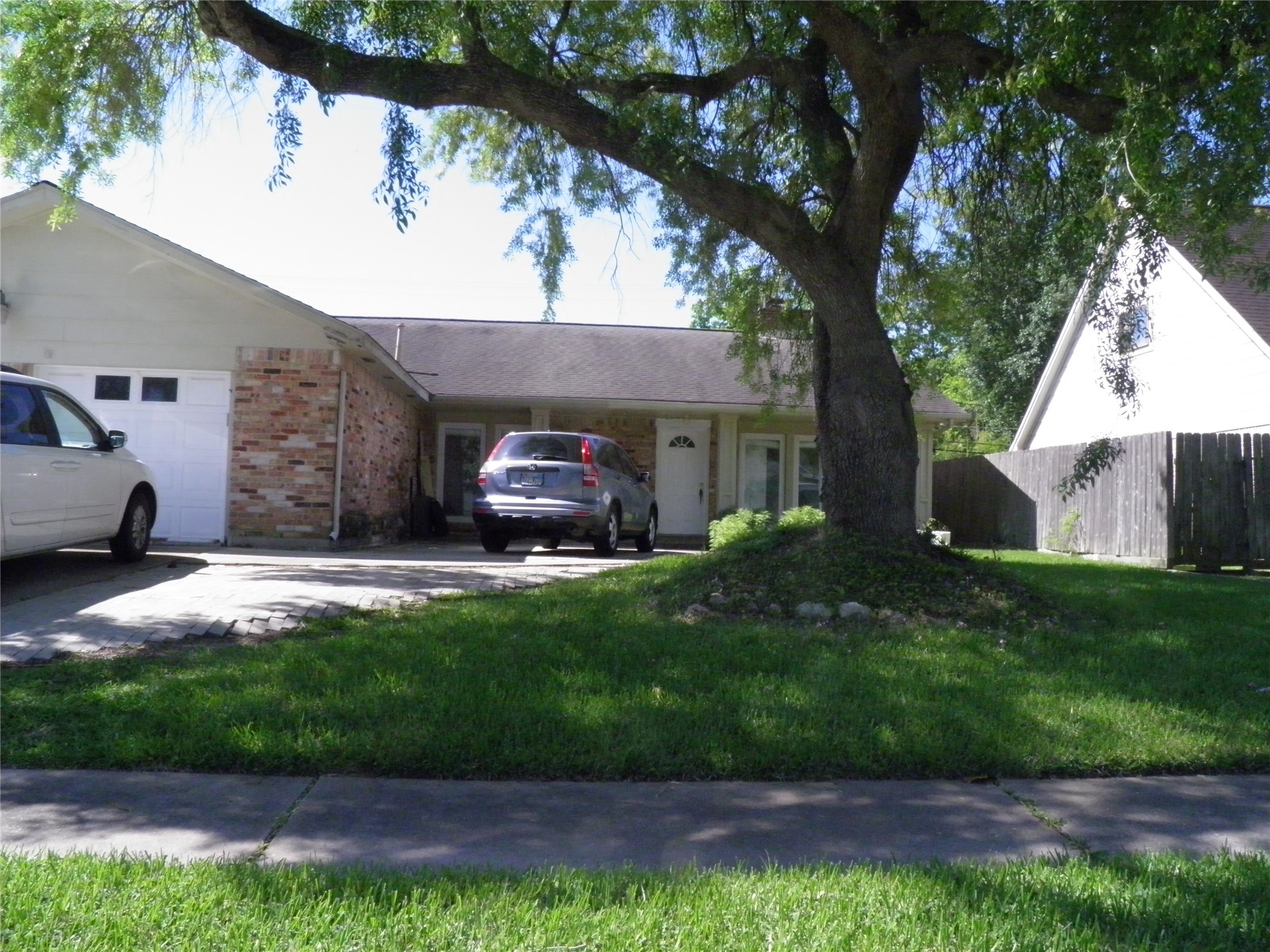 8827 Neff Street Houston, TX 77036 - Photo 2 of 12 a couple of cars parked in front of a house