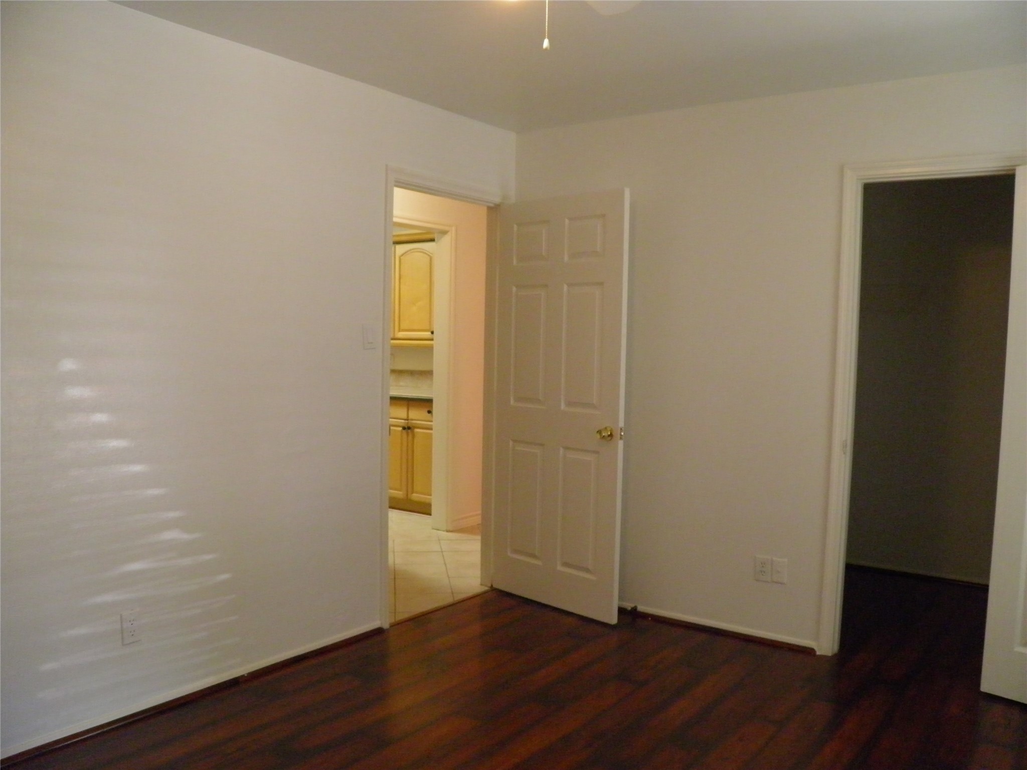 8827 Neff Street Houston, TX 77036 - Photo 5 of 12 a view of an empty room with wooden floor