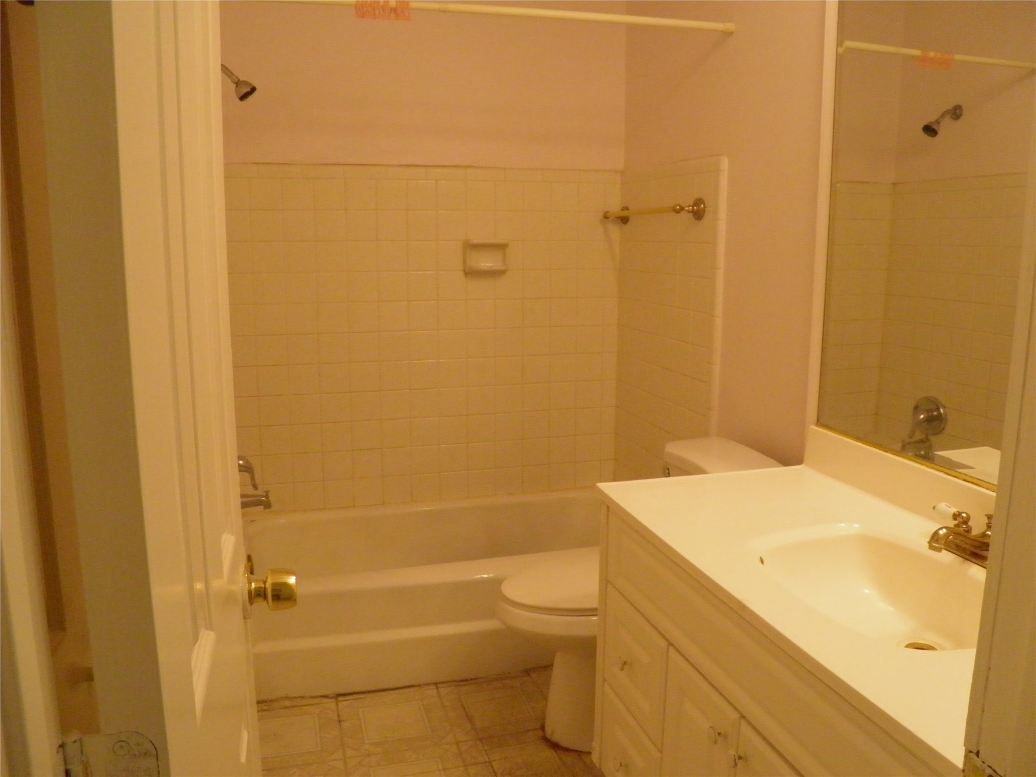 8827 Neff Street Houston, TX 77036 - Photo 7 of 12 a bathroom with a sink a toilet and shower