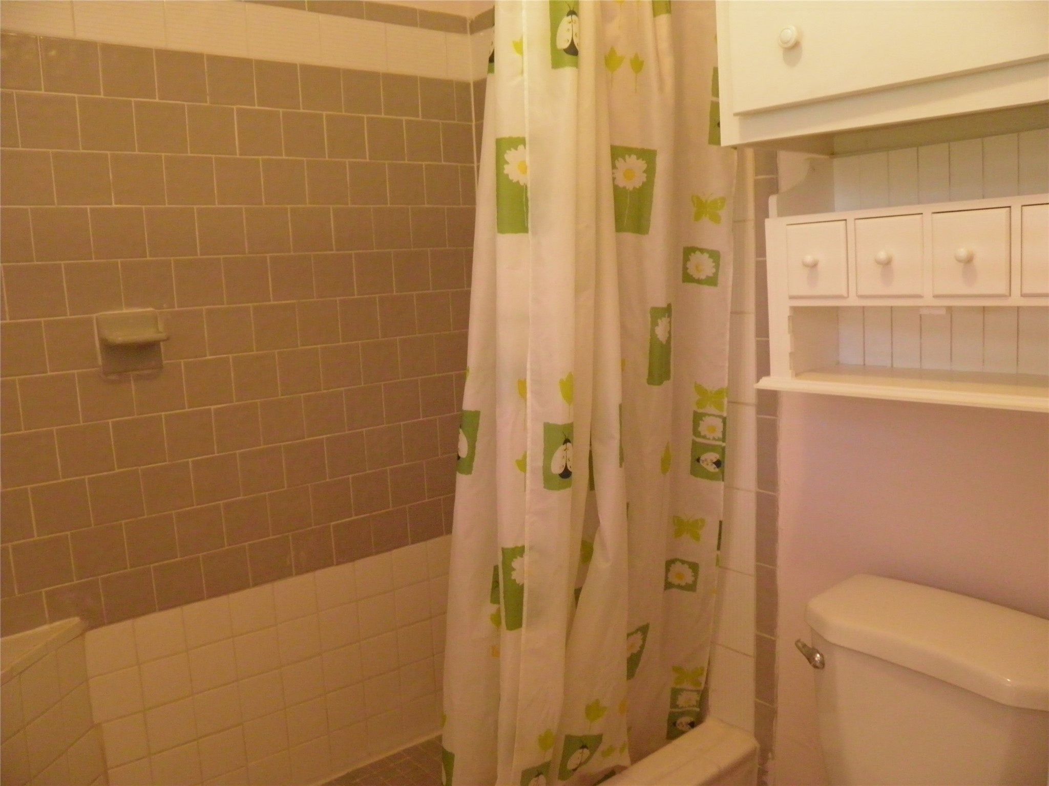 8827 Neff Street Houston, TX 77036 - Photo 10 of 12 a bathroom with a shower and a toilet