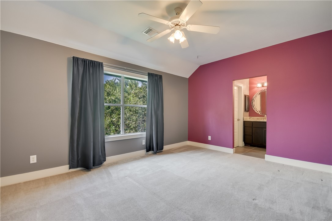 3513 Grimes Ranch Road Austin, TX 78732 - Photo 14 of 32 Empty room featuring ceiling fan, carpet, vaulted ceiling, and baseboards