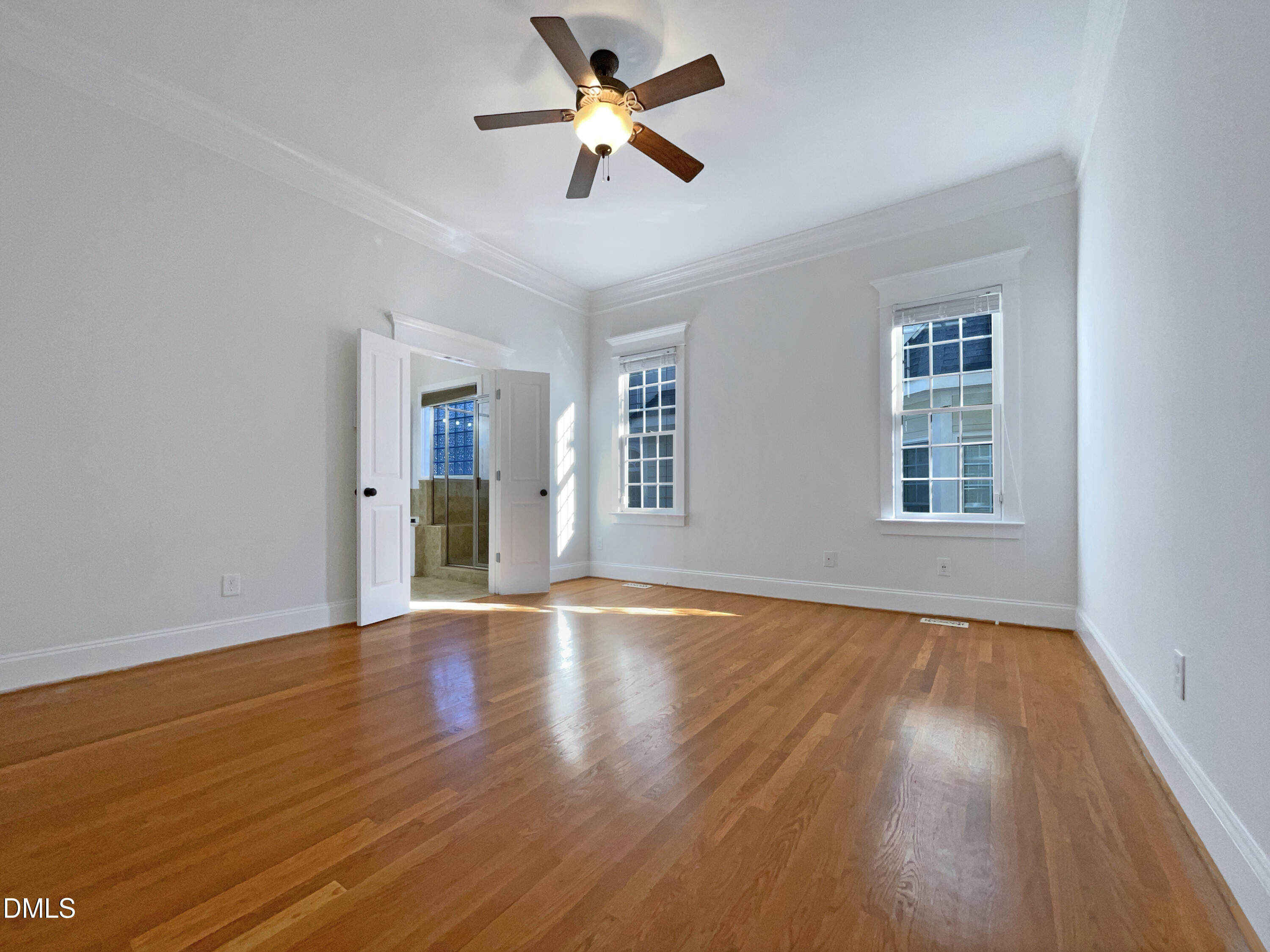 1703 Happiness Hill Lane Raleigh, NC 27614 - Photo 15 of 30 a view of an empty room with window and wooden floor