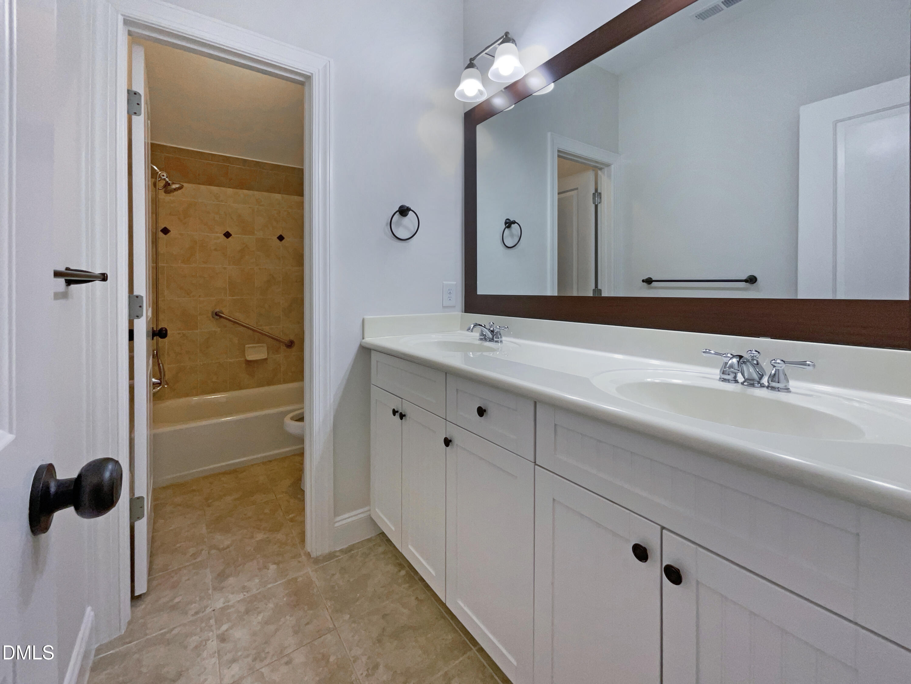 1703 Happiness Hill Lane Raleigh, NC 27614 - Photo 20 of 30 a bathroom with a granite countertop sink a mirror and shower