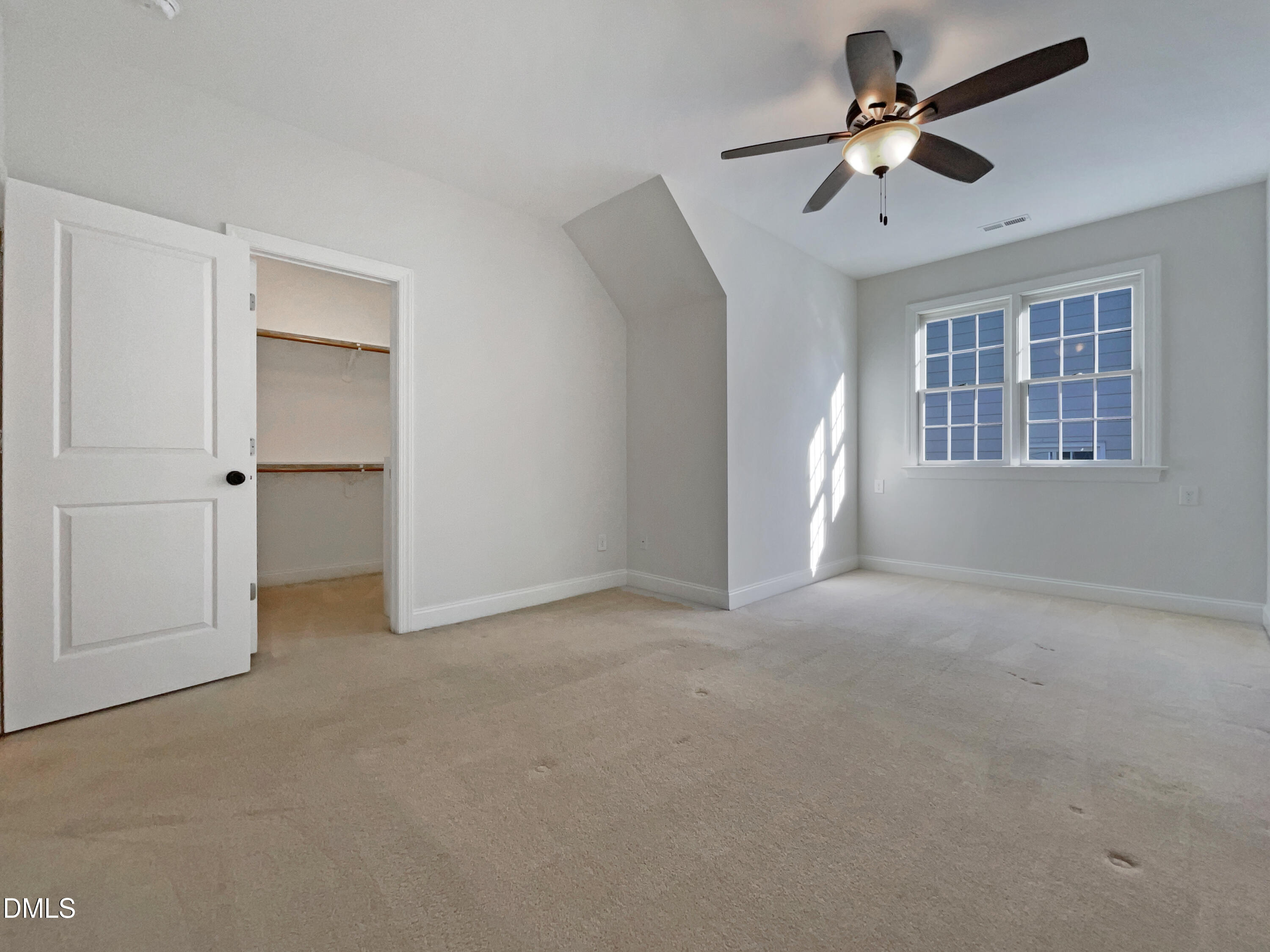 1703 Happiness Hill Lane Raleigh, NC 27614 - Photo 23 of 30 a view of a livingroom with a ceiling fan and window