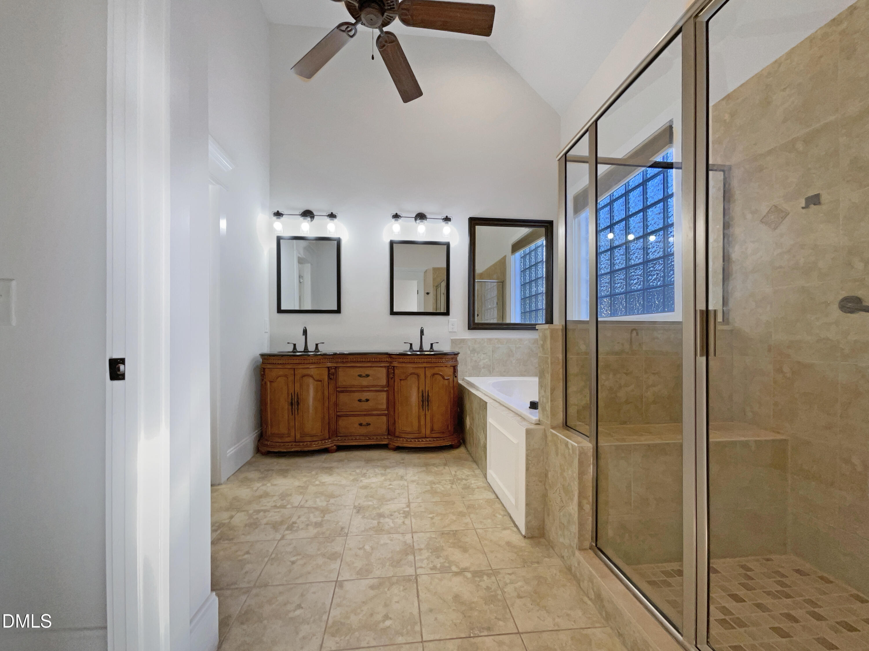 1703 Happiness Hill Lane Raleigh, NC 27614 - Photo 6 of 30 a bathroom with a tub a sink and a mirror
