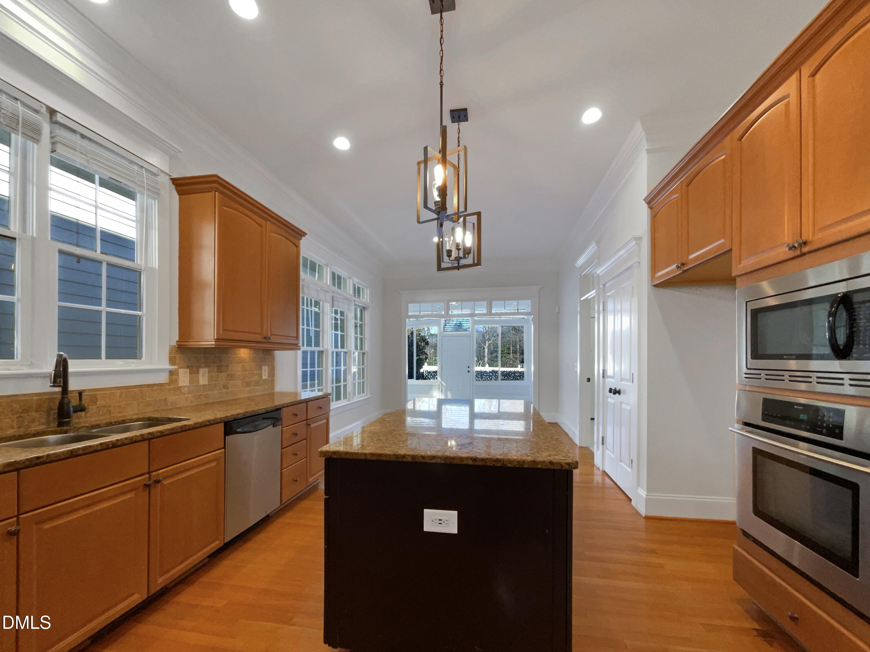 1703 Happiness Hill Lane Raleigh, NC 27614 - Photo 10 of 30 a kitchen with stainless steel appliances granite countertop a sink stove and refrigerator