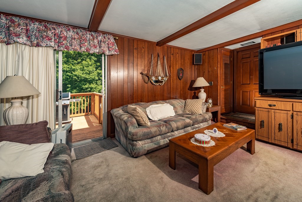 46 Pilgrim Road Braintree, MA 02184 - Photo 16 of 35 a living room with furniture a window and a flat screen tv