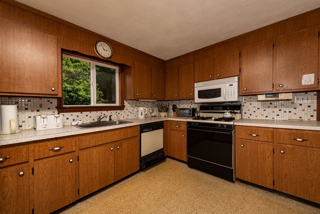 46 Pilgrim Road Braintree, MA 02184 - Photo 17 of 35 a kitchen with sink cabinets and window