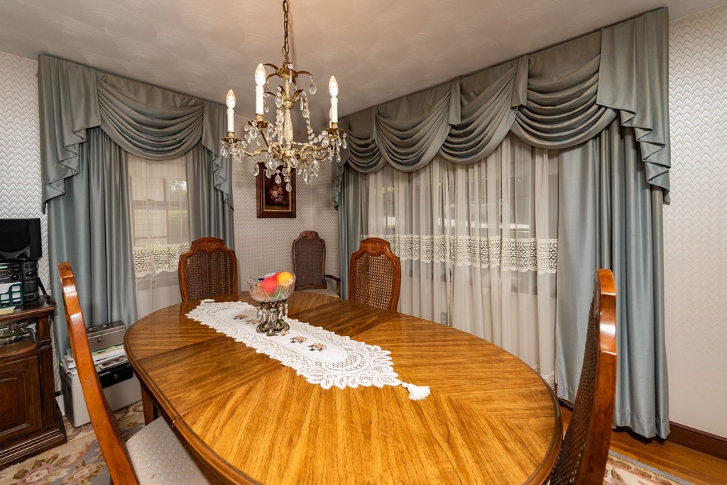 46 Pilgrim Road Braintree, MA 02184 - Photo 21 of 35 a bedroom with a bed and a chandelier