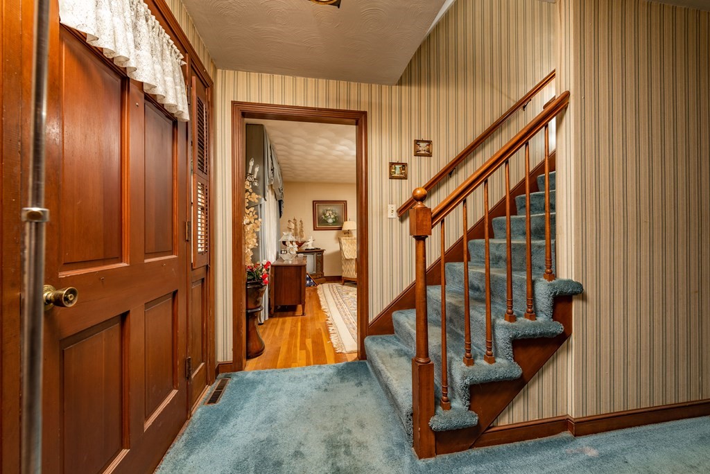46 Pilgrim Road Braintree, MA 02184 - Photo 22 of 35 a view of entryway with wooden floor and stairs