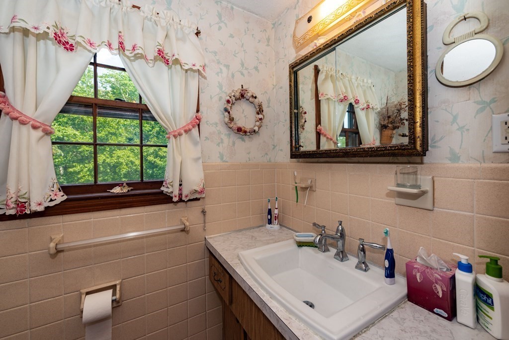 46 Pilgrim Road Braintree, MA 02184 - Photo 26 of 35 a bathroom with a sink and a mirror