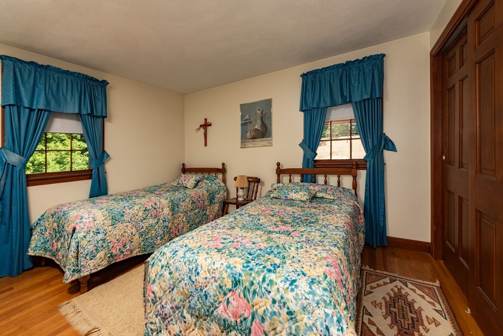 46 Pilgrim Road Braintree, MA 02184 - Photo 31 of 35 a bedroom with two beds and a dresser next to a window