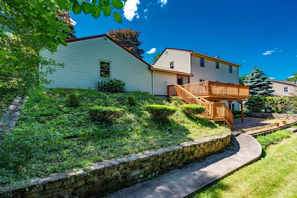 46 Pilgrim Road Braintree, MA 02184 - Photo 6 of 35 a aerial view of a house with a yard and potted plants