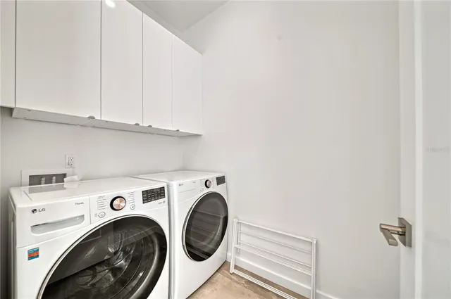 a living room with stainless steel appliances kitchen island furniture and a view of kitchen