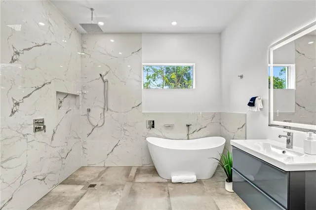 a spacious bathroom with a bathtub and shower