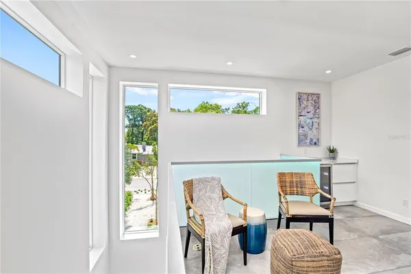 a bedroom with a bed and a chair