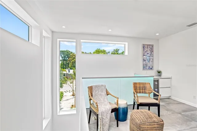 a bedroom with a bed and a chair