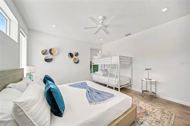 a bedroom with a bed and a table