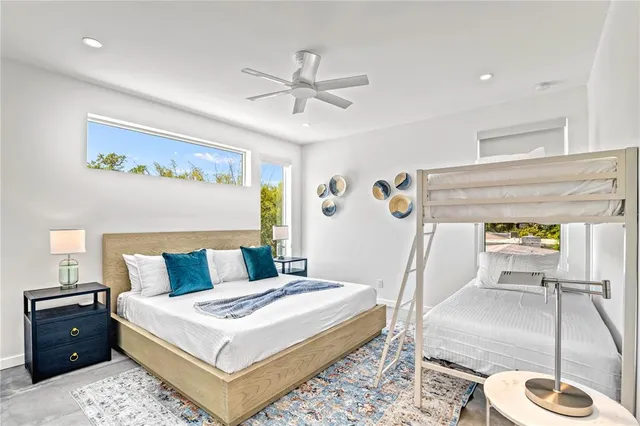 a bedroom with a large bed and a window