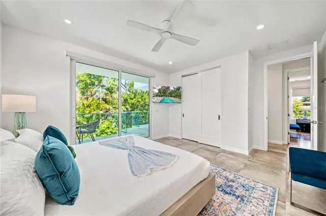 a bathroom with a toilet sink a mirror and shower