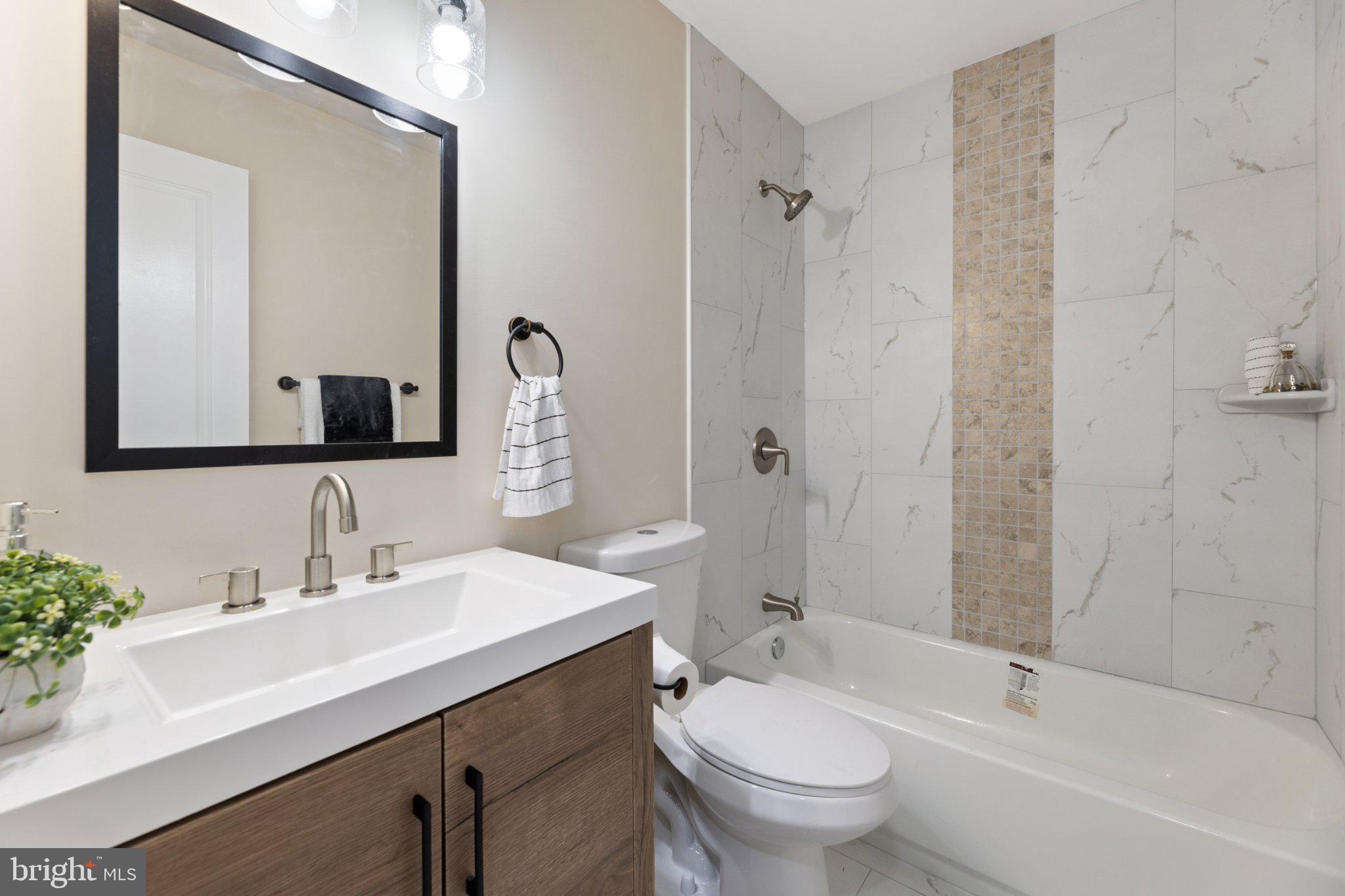 3215 Edgewood Road Kensington, MD 20895 - Photo 26 of 37 Modern elegance in a serene bathroom.