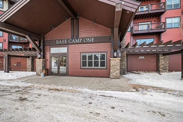 a front view of a building with a garage