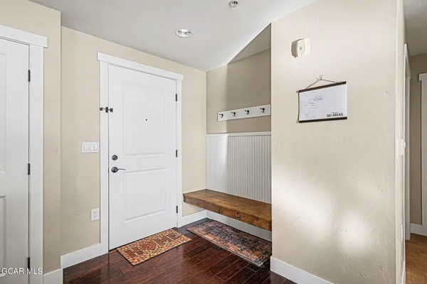 a bedroom with furniture and a flat screen tv