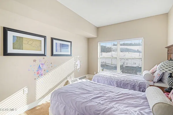 a bedroom with a bed and a closet